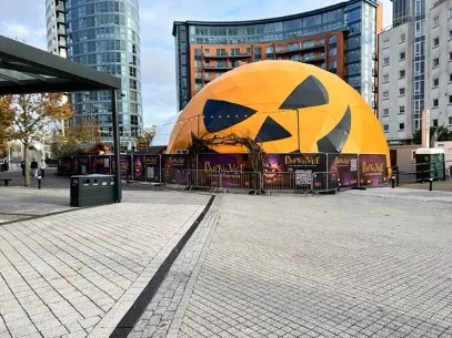 Giant illuminated pumpkin at a seasonal visitor attraction